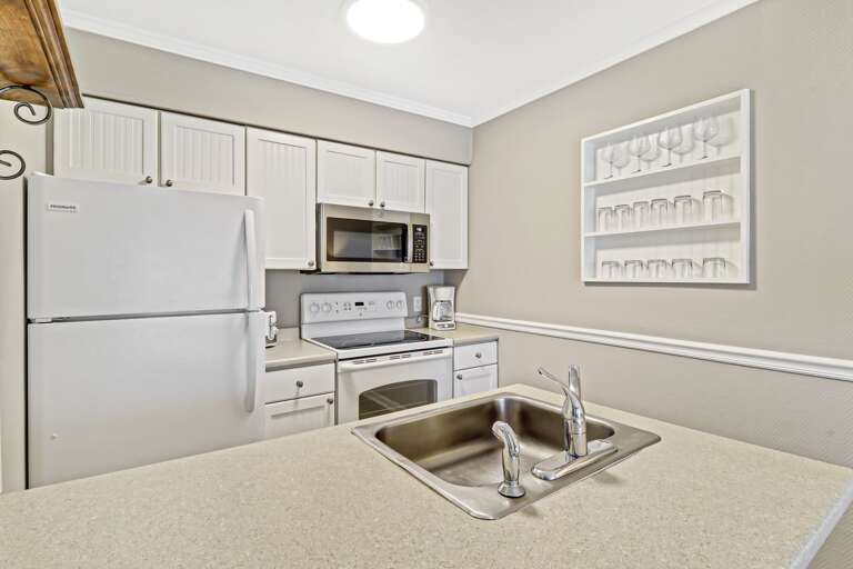 Newly painted full sized kitchen with new microwave and regular drip coffee maker.  Plenty of glassware for all your beverages.  