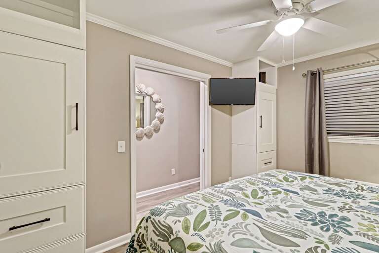 Plenty of closet space, along with wall mounted flat screen TV in this newly renovated bedroom.  