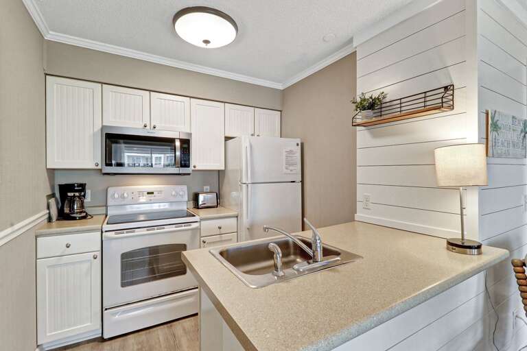 Newly painted, bright, coastal kitchen - fully equipped with standard drip coffeemaker. 