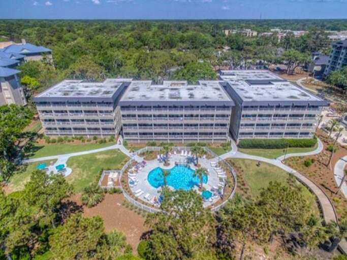 Ocean Dunes Oceanfront buildings are steps way from Hilton Head's best beaches with and pool and grilling area. 