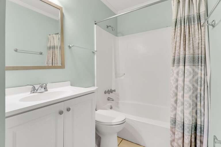 The Master Bathroom has a large vanity and a shower/tub combo.