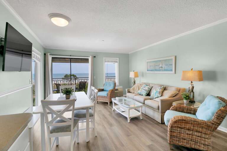 The Livingroom has plenty of space with the newly decorated furnishings.  Oceanfront views from openness of living room/dining room.