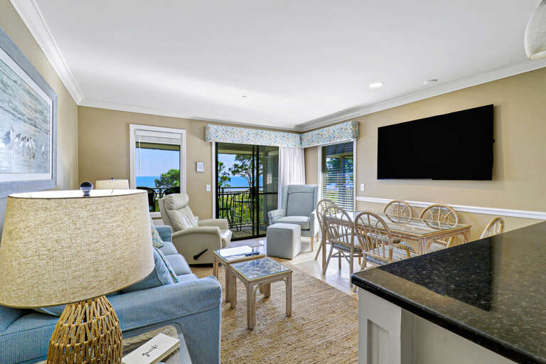 Interior Living Space With Furniture And TV, Balcony View