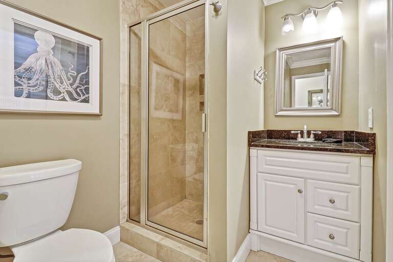 Nicely tiled walk-in shower in this guest bathroom.