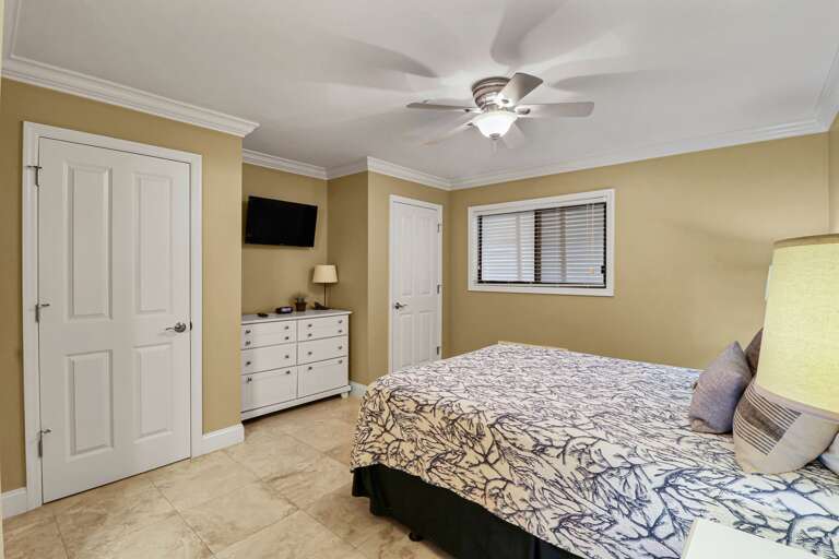 The Master Bedroom has  a  queen bed and access to private bathroom.
