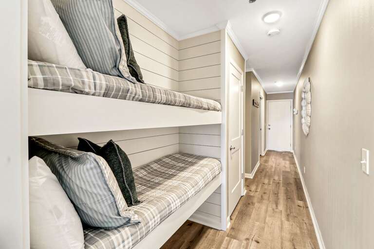 Great use of space to take care of sleeping arrangements for your small children.  They will love this unique space.  