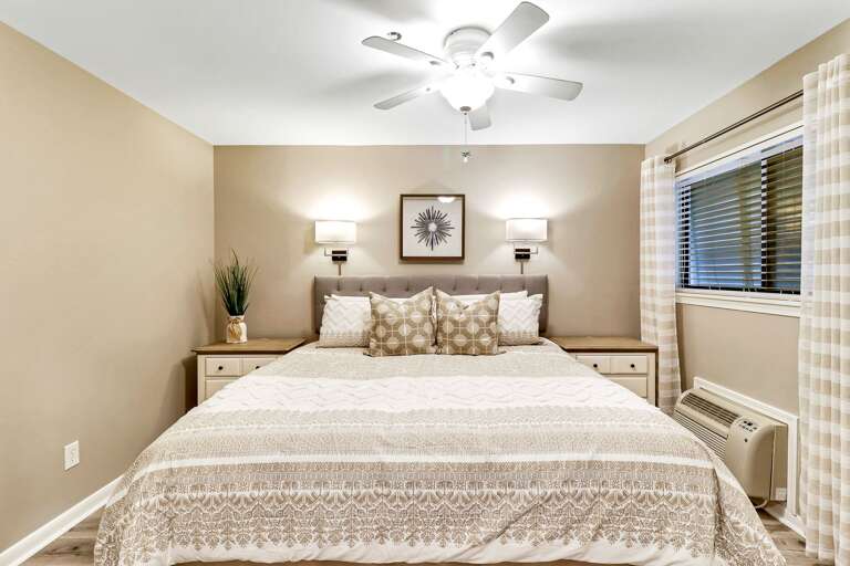 newly renovated bedroom with cozy king size bed.  A great place to unwind and get a good night's sleep!  Individual A/C unit.   