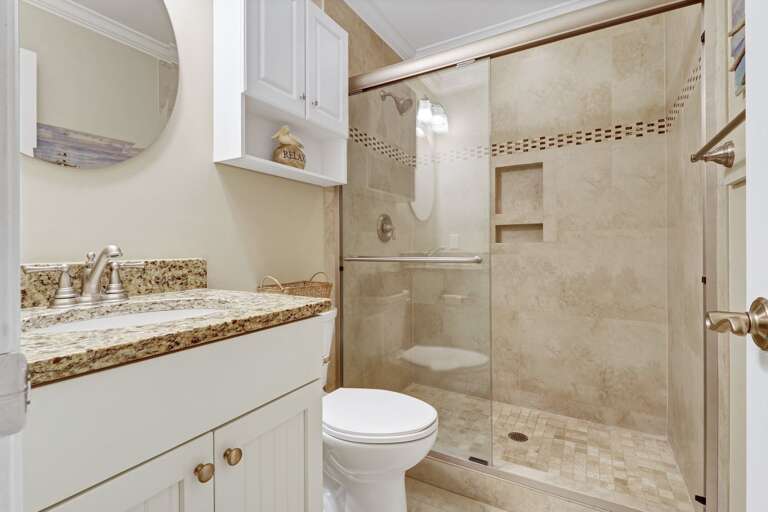 Newly renovated bathroom with lovely tiled walk-in shower.  