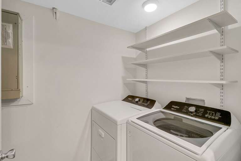 Full size washer/dryer is just off the kitchen. 