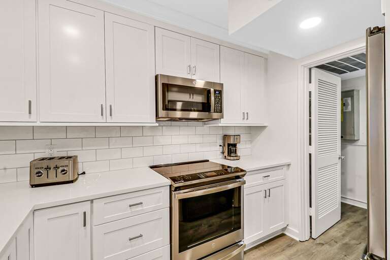 All new stainless appliances, regular drip coffeemaker and plenty of counter space.   