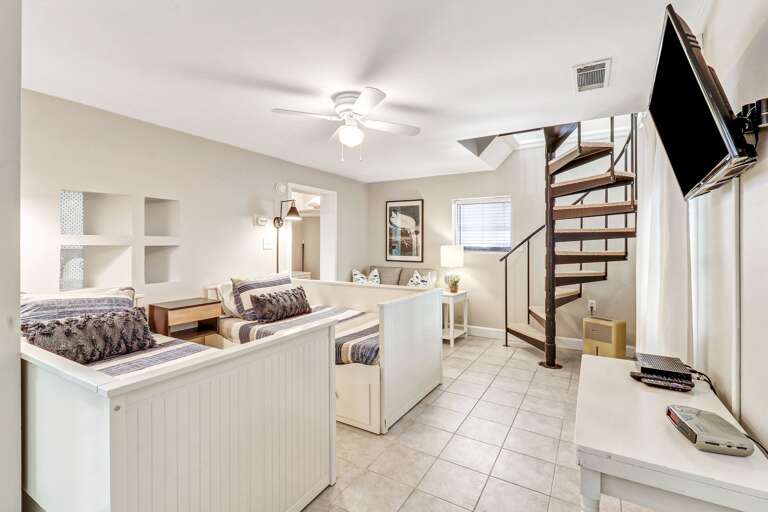 Twin size beds in lower floor of guest house with their own TV Twin size beds in lower floor of guest house with their own TV