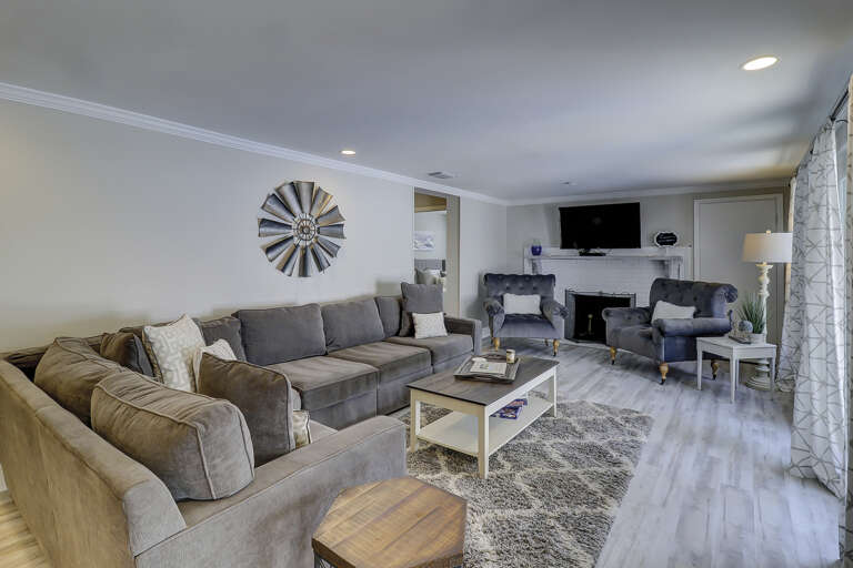 Spacious living room area with flat screen TV.  Spacious living room area with flat screen TV.