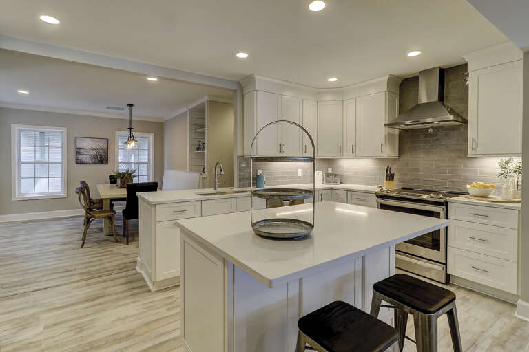 Newly renovated kitchen which looks looks into dining room. 