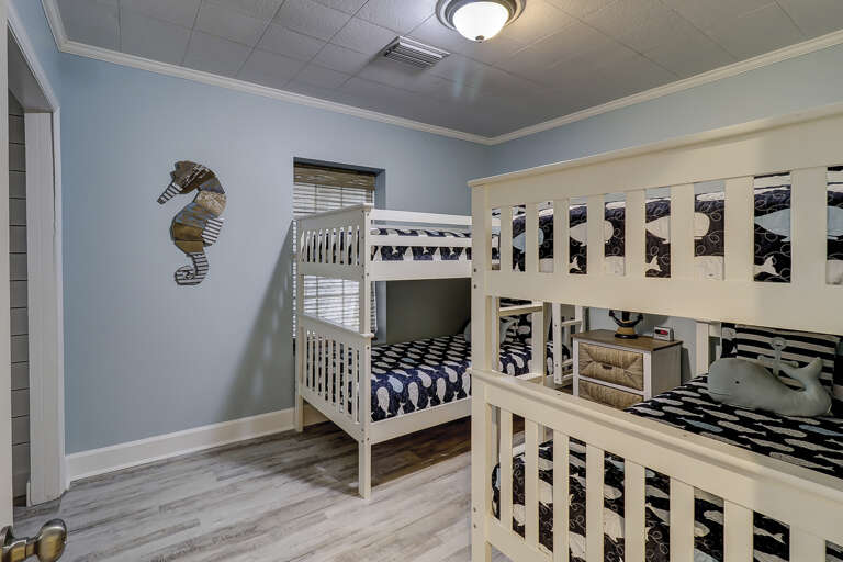 Kids room with four bunk beds and flat screen TV.  Kids room with four bunk beds and flat screen TV.