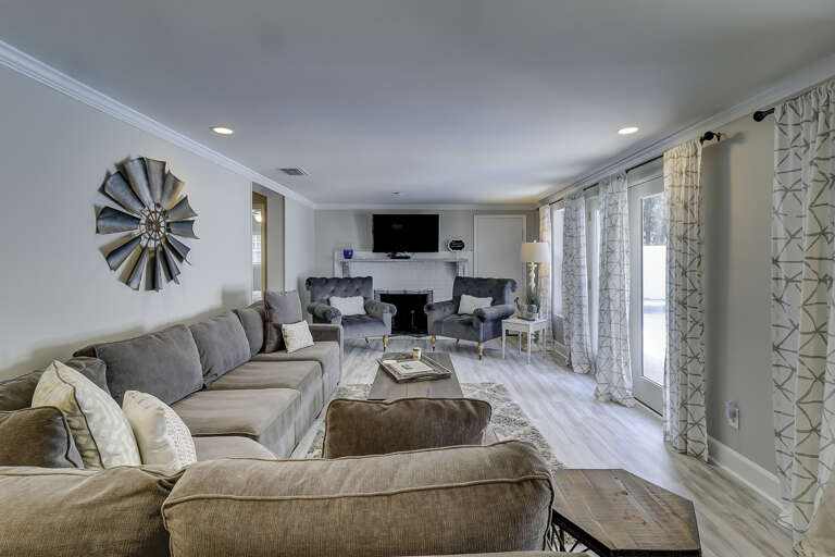 Spacious living room area with flat screen TV. Spacious living room area with flat screen TV.