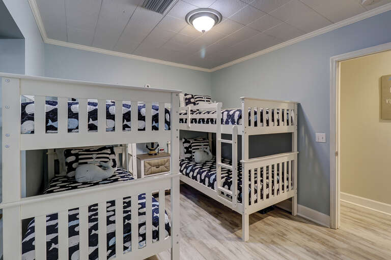 Kids room with four bunk beds and flat screen TV.  Kids room with four bunk beds and flat screen TV.