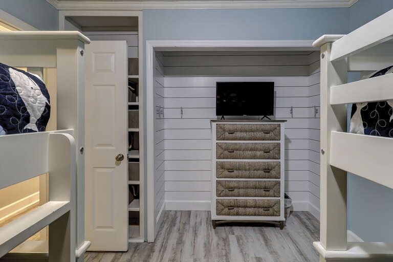 Kids room with four bunk beds and flat screen TV.  Kids room with four bunk beds and flat screen TV.