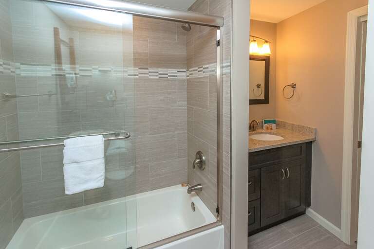 Private bath which has been completely remodeled and includes a shower and tub combination.  Private bath which has been completely remodeled and includes a shower and tub combination.