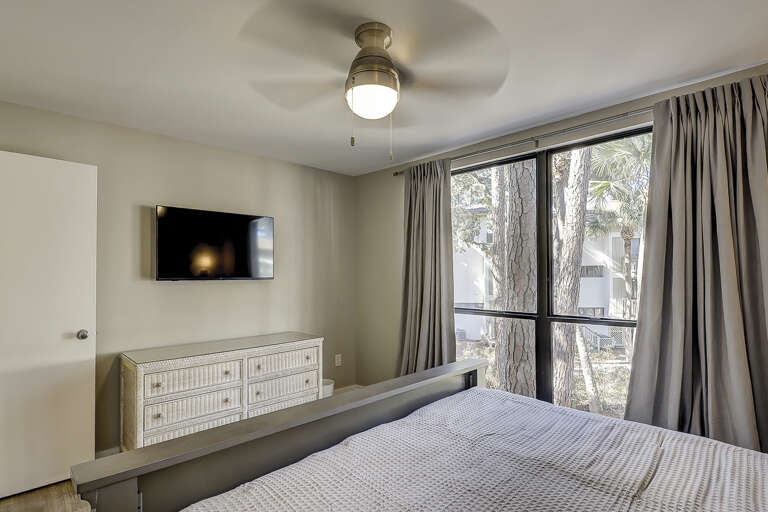 The second guest bed features a king-size bed, great for relaxing after a day at the beach