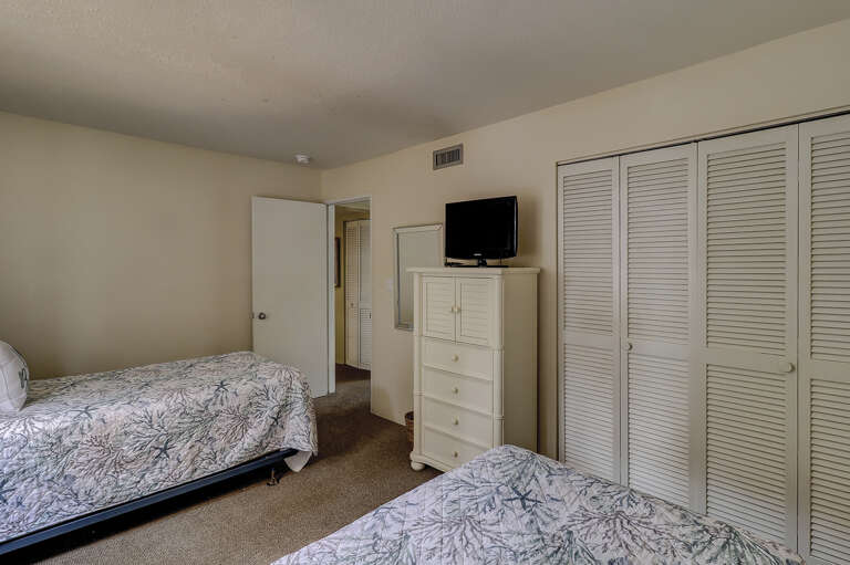 Guest room with flat screen two twin beds.