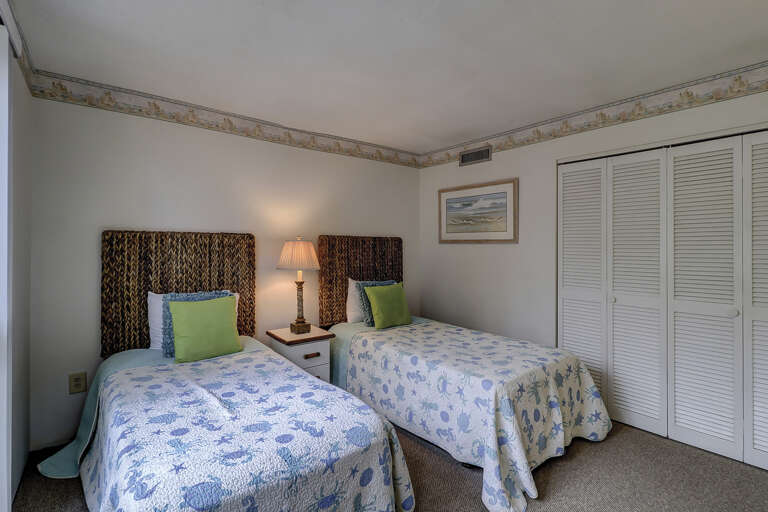 Guest room with flat screen two twin beds.