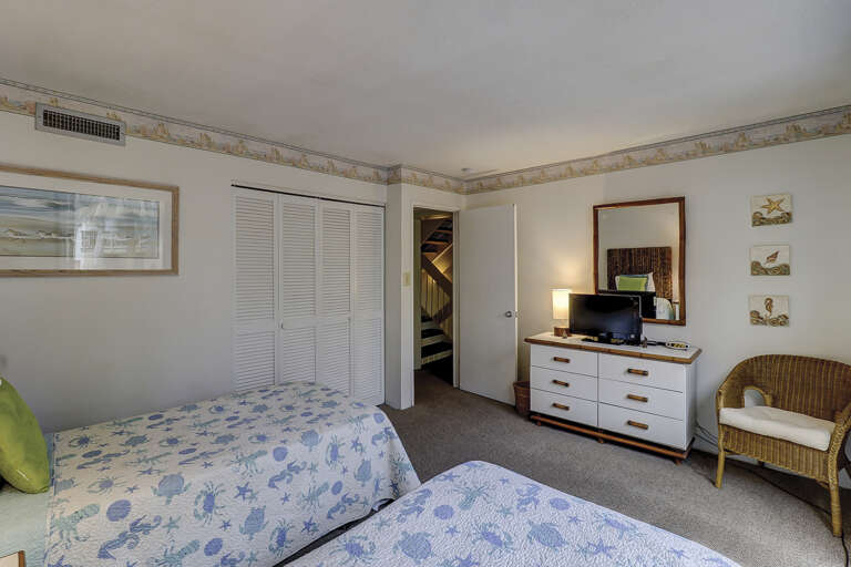 Guest room with flat screen two twin beds.