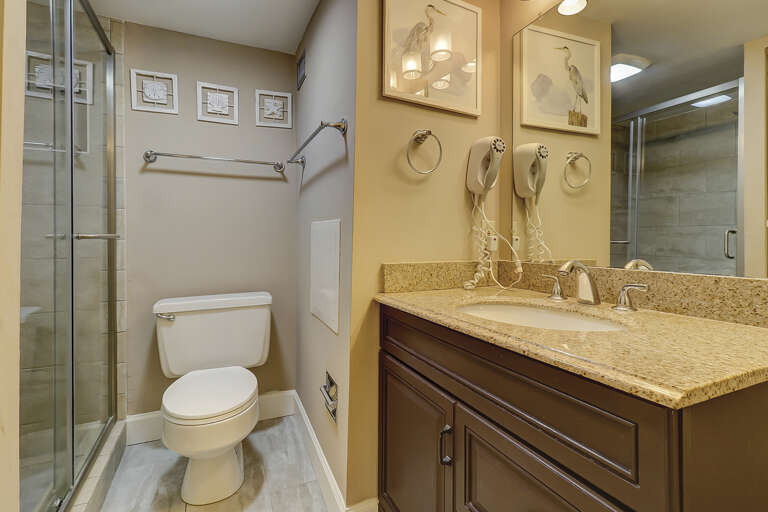 Bathroom vanity in updated bathroom with walk in shower.  