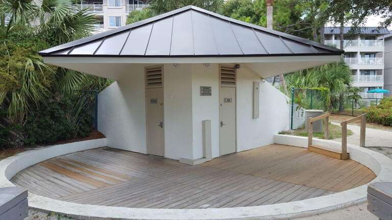 Bathroom cabana by beach walk path .