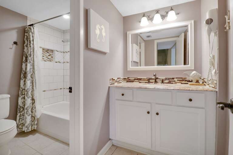 Newly renovated bathroom with shower/tub combination. 