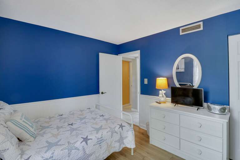 Plenty of storage along with a TV in this newly renovated villa. 