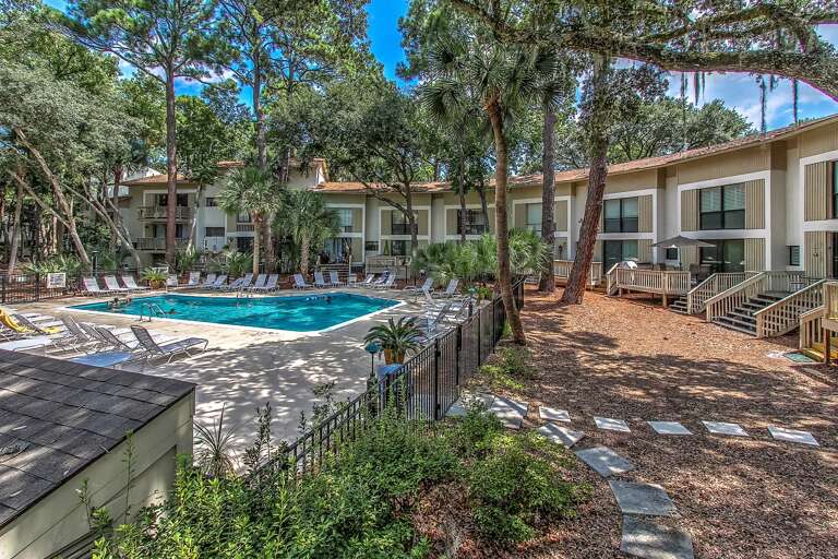 Beautiful refreshing shaded saltwater pool steps from your beach vacation villa. Seascape villas are across the street from Hilton Head pristine beaches. Typically a 3 to 4 minute walk to the beach. Once on the beach a short half mile walk to Coligny Beac