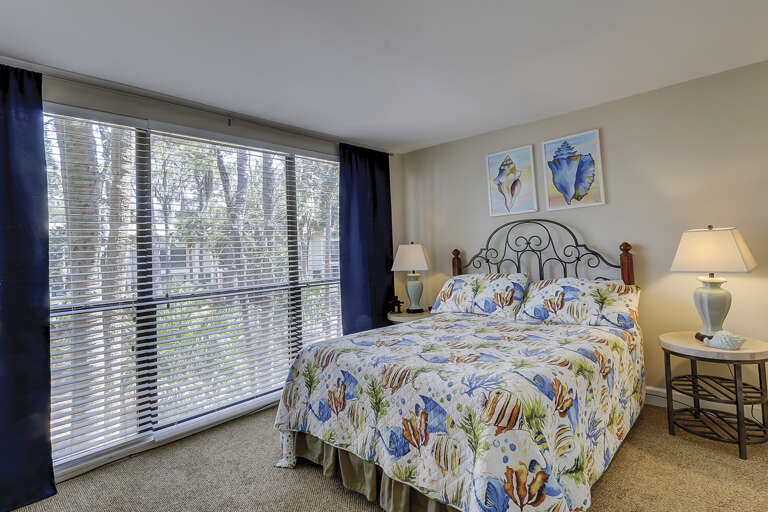 1 queen bed with floor length windows. 