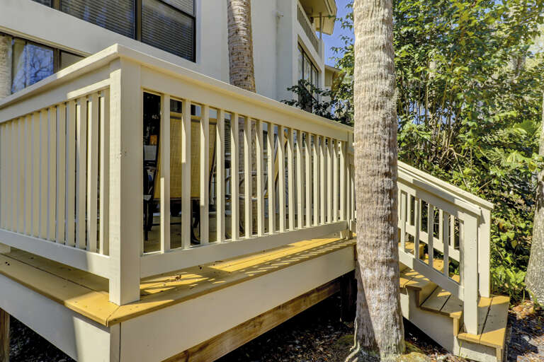 First floor deck leads down to the beautiful Seascape grounds. 
