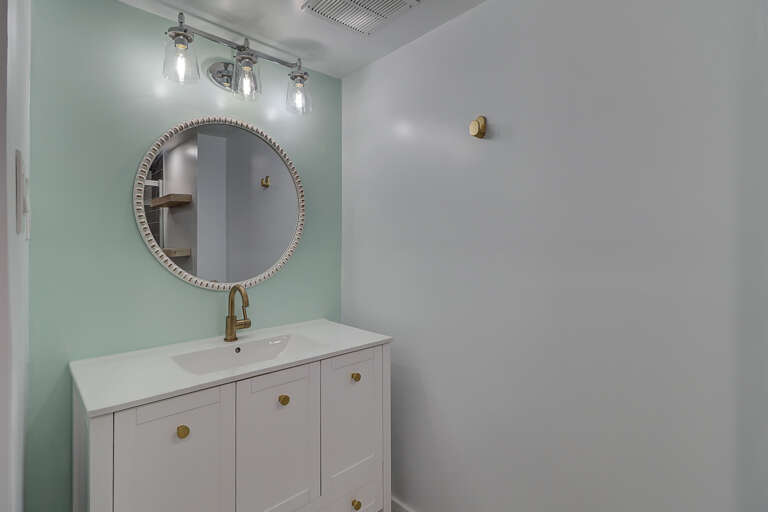 Bathroom vanity in updated bathroom. 
