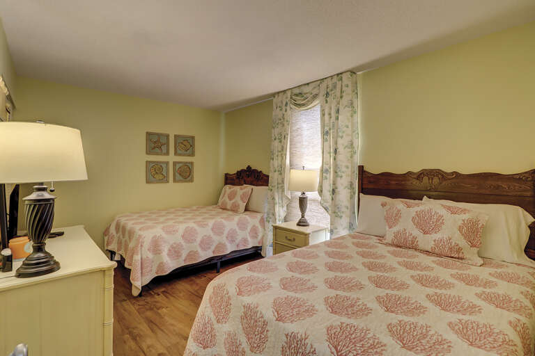 Guest room with flat screen two full beds.