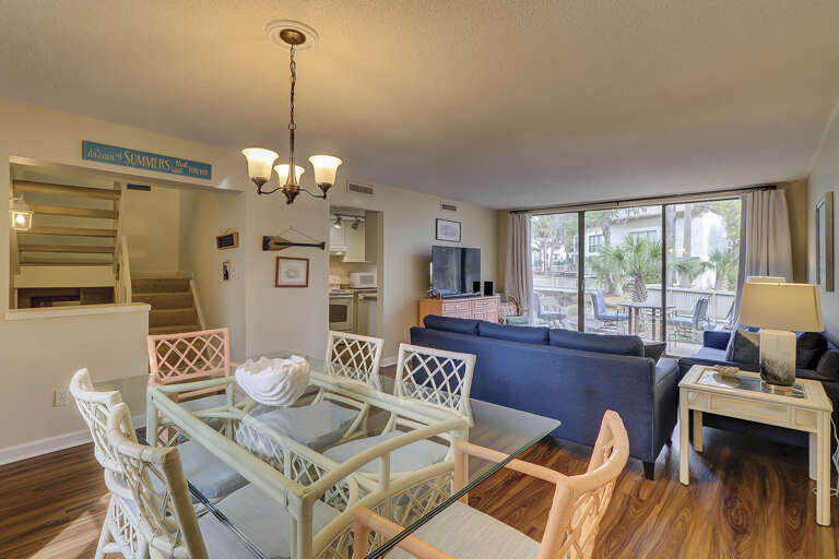 Dining area features a dining room table with seating for six  family members and friends to enjoy home cooked meals.