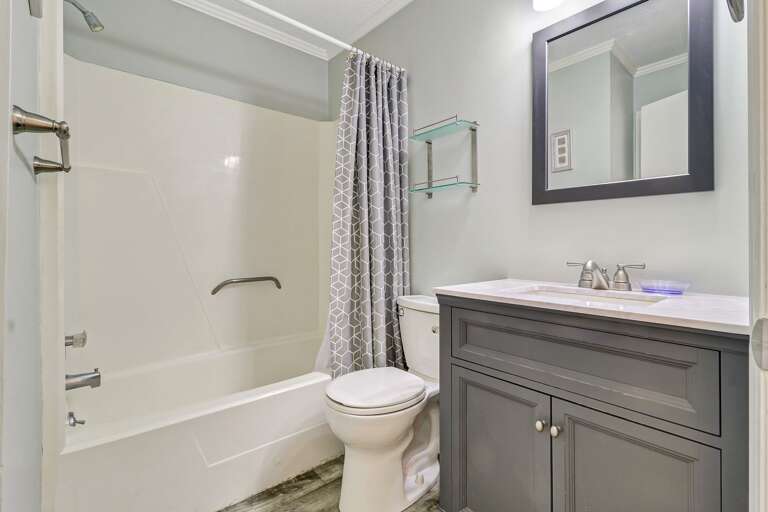 Beautiful renovated bathroom with shower tub combination 