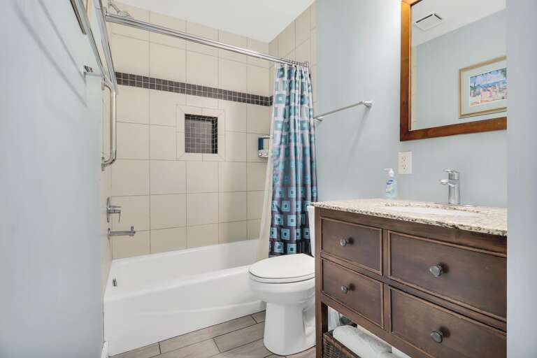 The bath has been totally remodeled as well with a walnut vanity with a granite top, all Grohe fixtures, Kohler tub with custom tile surround. The bath has been totally remodeled as well with a walnut vanity with a granite top, all Grohe fixtures, Kohler tub with custom tile surround.