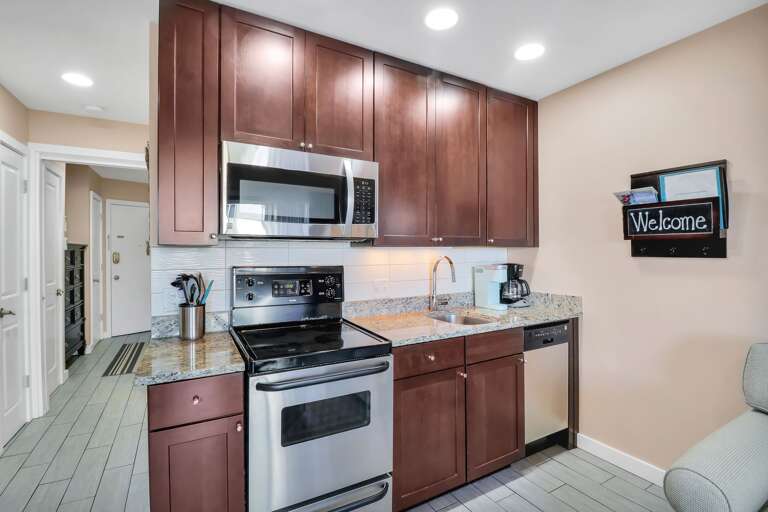 The Cherry Bordeaux cabinets, granite counter top, under mount sink and Grohe faucet are sure to please! The Cherry Bordeaux cabinets, granite counter top, under mount sink and Grohe faucet are sure to please!