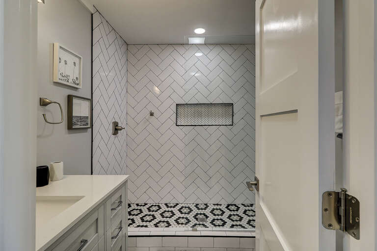 The bathroom in this Sea Side Villa 122 has a glass and tile shower.  The tile work in the shower offers an interesting design and a built-in niche for toiletries.  The bathroom in this Sea Side Villa 122 has a glass and tile shower.  The tile work in the shower offers an interesting design and a built-in niche for toiletries.
