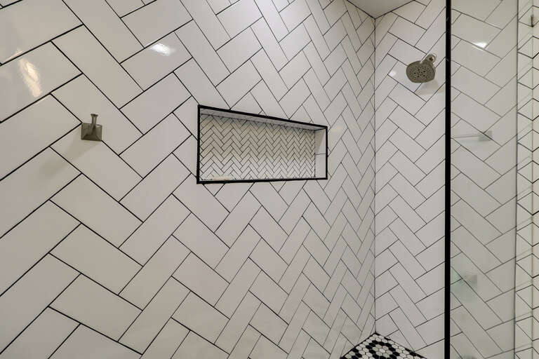 The bathroom in this Sea Side Villa 122 has a glass and tile shower.  The tile work in the shower offers an interesting design and a built-in niche for toiletries.  The bathroom in this Sea Side Villa 122 has a glass and tile shower.  The tile work in the shower offers an interesting design and a built-in niche for toiletries.
