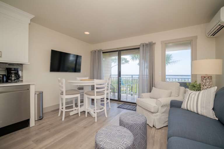 Living Room With Kitchenette And Balcony Access