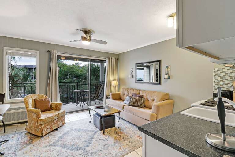 Interior Living Space With Kitchenette And Balcony Access