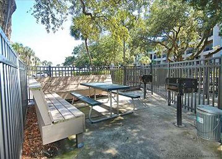 Enjoy outdoor grilling or a barbeque at Seaside Villas' grilling area.