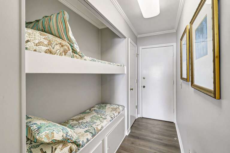 Located in the hallway, these bunk beds are designed for small children only.  New bedding,  