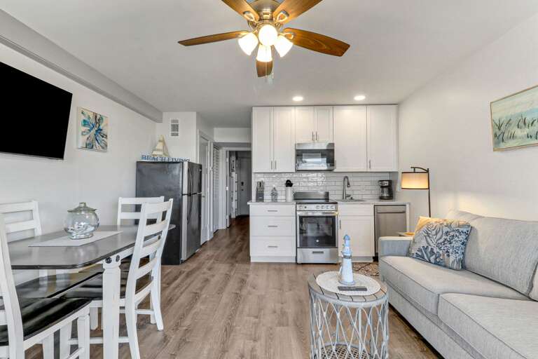 An overview of the main living area in this unit. Features a kitchenette and fridge, great for storing any groceries!