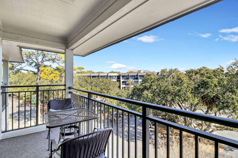 Balcony off living room with view to the water