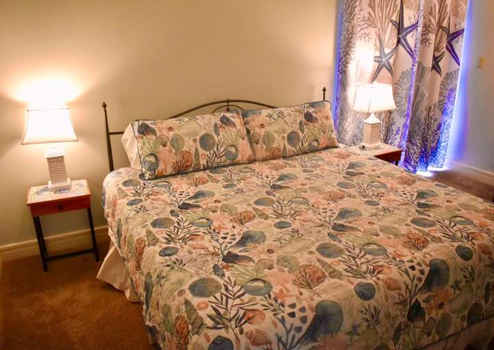 Bedroom With Patterned Bedding And Bedside Lamps Bedroom With Patterned Bedding And Bedside Lamps