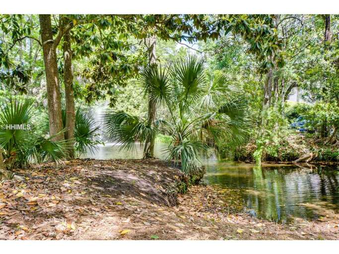 Xanadu's grounds with a lagoon and water fountain.