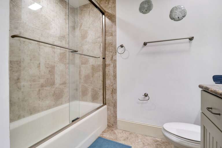 New tub/shower combination in guest bathroom for getting cleaned up after a day at the beach!